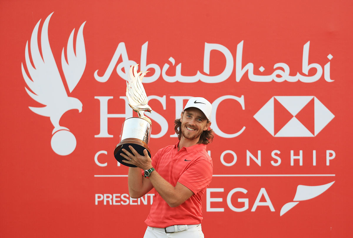 Tommy Fleetwood of England celebrates with the winner's trophy after the final round of the Abu Dhabi HSBC Golf Championship at Abu Dhabi Golf Club on January 21, 2018 in Abu Dhabi.