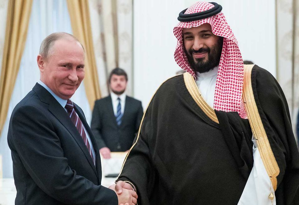 Russian President Vladimir Putin (L) shakes hands with Saudi Deputy Crown Prince and Defence Minister Mohammed bin Salman during a meeting at the Kremlin in Moscow on May 30, 2017.