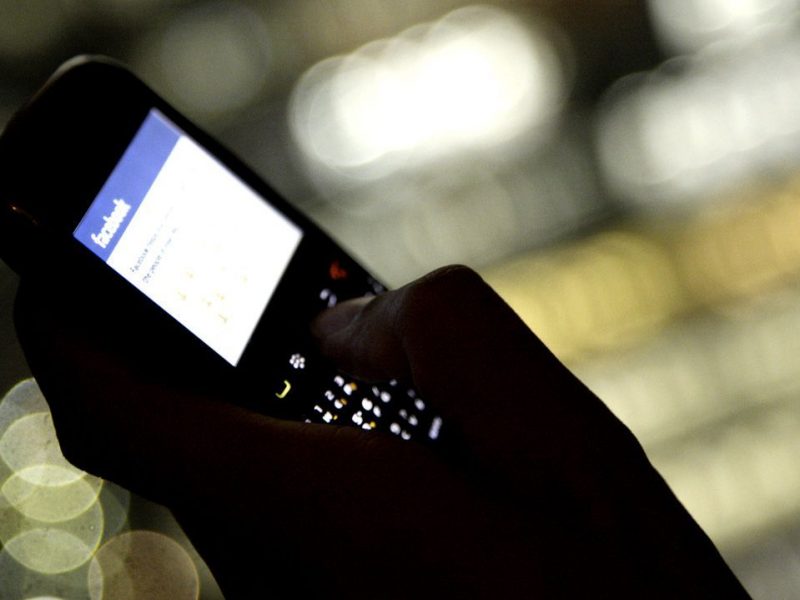 The Facebook Inc. website is displayed on a smartphone in this arranged photograph in Tokyo, Japan, on Wednesday, May 16, 2012. Facebook Inc. is boosting the number of shares for sale in its initial public offering to 421 million, letting it raise as much as $16 billion, two people with knowledge of the deal said. (Bloomberg)