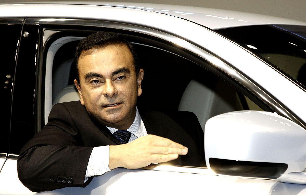 Nissans CEO Carlos Ghosn introduces the companys electric vehicle Fuga Hybrid during the 41st Tokyo Motor Show at Makuhari Messe on October 21 2009