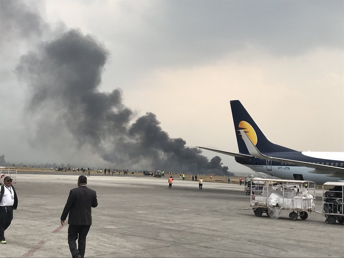 A Bangladeshi plane with 67 passengers and four crew on board crashed and burst into flames as it was coming in to land at Kathmandu airport. Image: Bishnu Sapkota (twitter.com/Bishnusapkota).