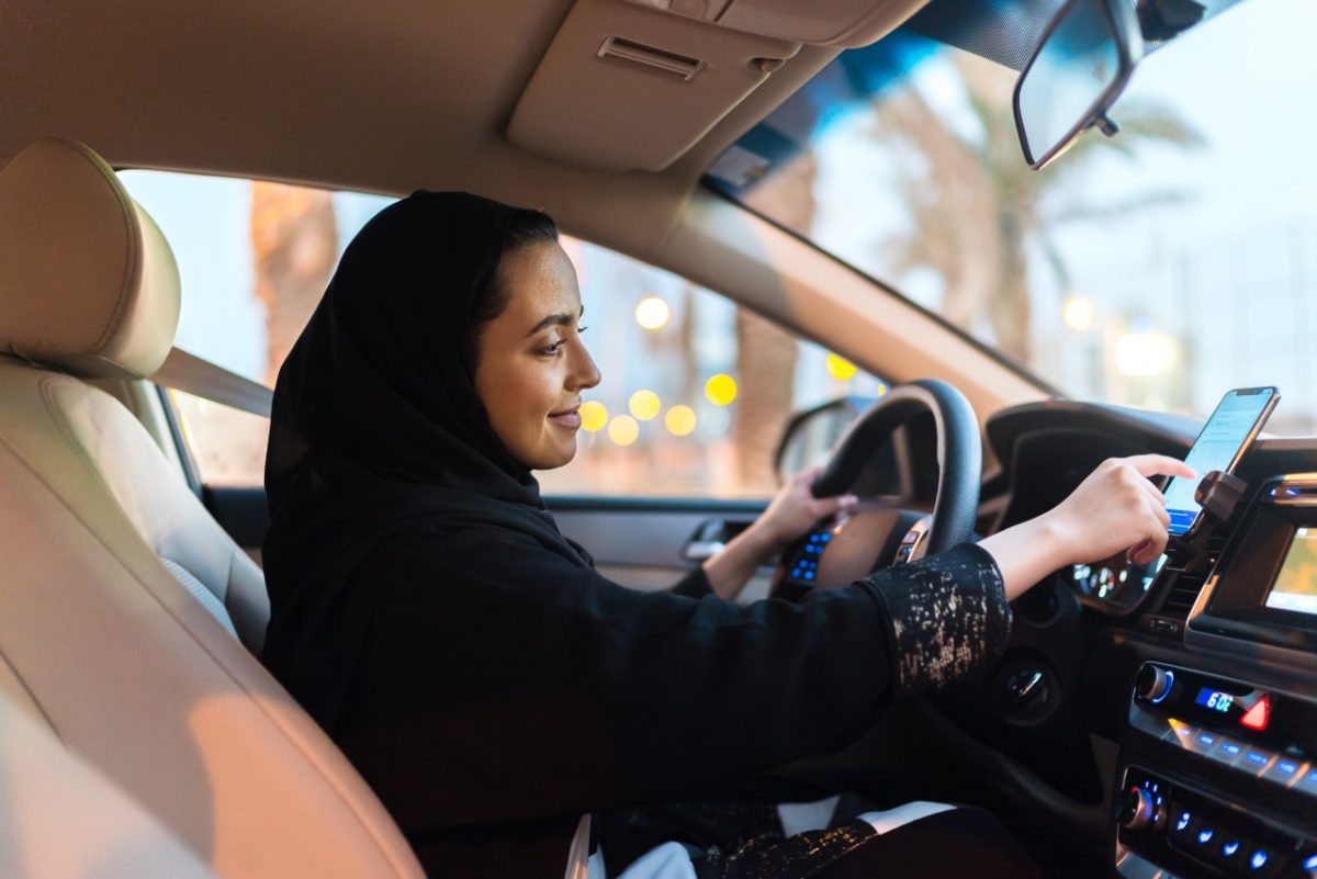 A Saudi female Uber driver behind  the wheel.