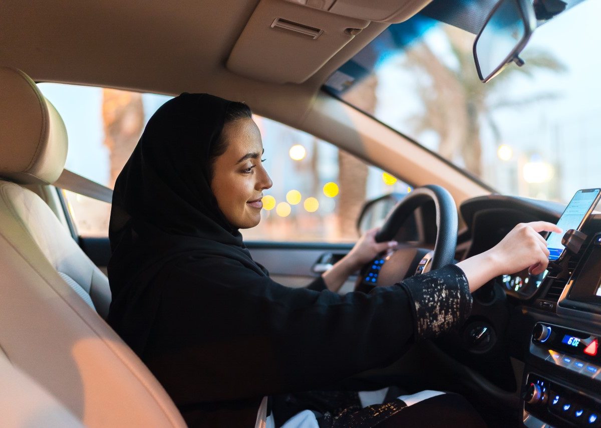 A Saudi female Uber driver behind  the wheel.