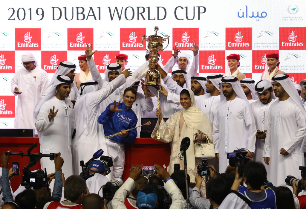 Christophe Soumillon jockey of Thunder Snow celebrates winning the Dubai World Cup sponsored by Emirates Airline with the trophy after the Dubai World Cup at Meydan Racecourse 
 Photo: Francois NelGetty Images