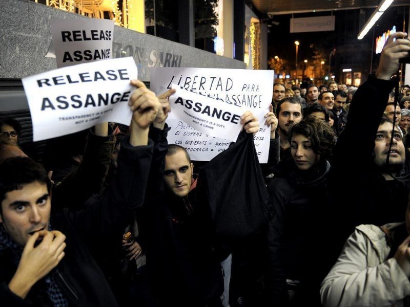 People gather to protest the arrest of Wikileaks founder Julian Assange