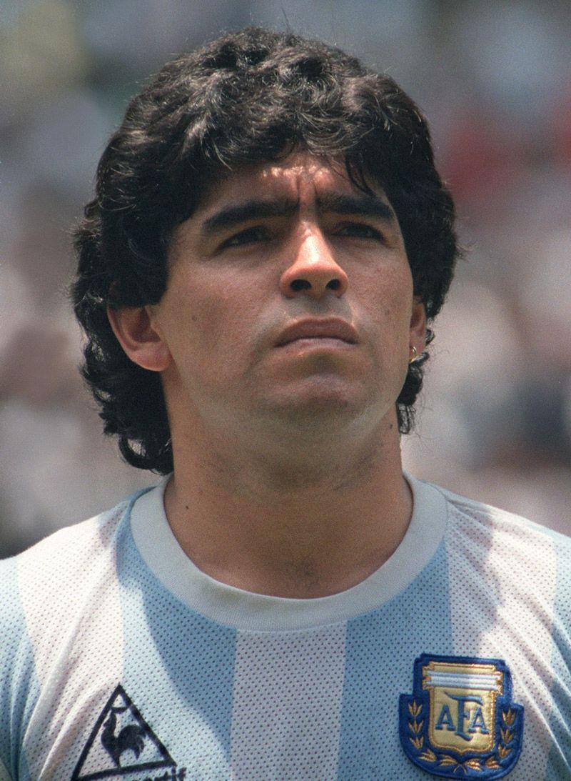 Former Argentina's soccer star Diego Maradona, left, shields the