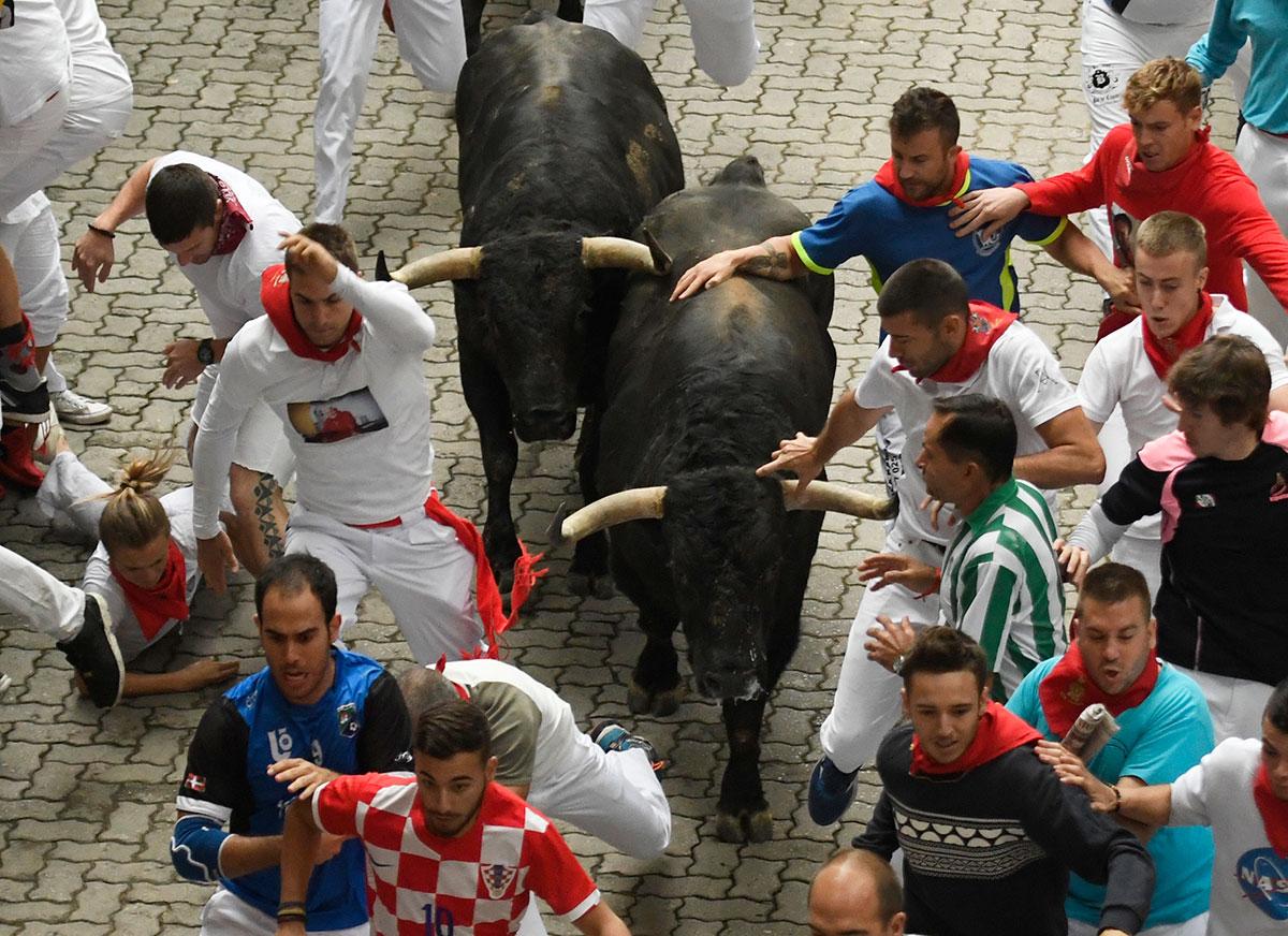 In pictures: Bull running festival in Spain - Arabian Business: Latest ...