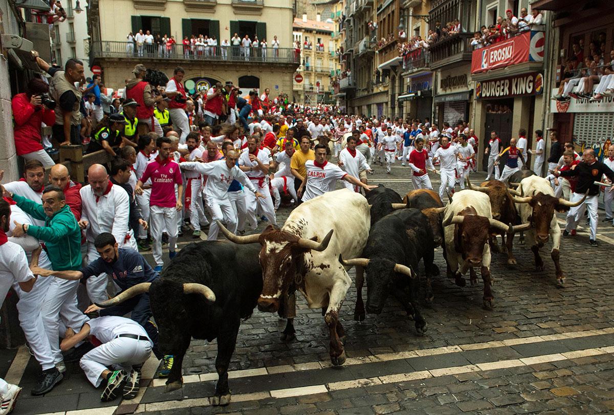 In pictures: Bull running festival in Spain - Arabian Business: Latest ...