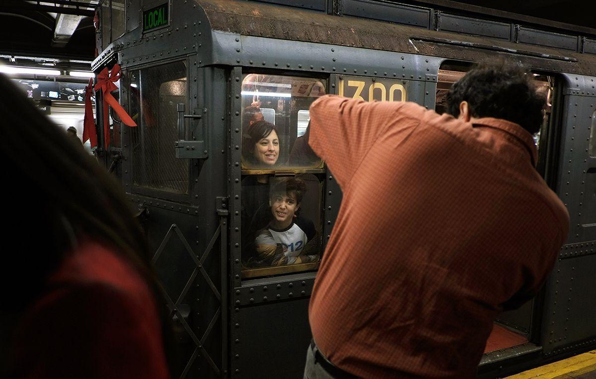 Riders enjoy vintage New York City subway trains in annual holiday