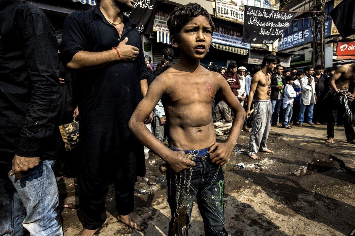 A young Muslim boy displays his stick-fighting skills during a procession  to mark Ashoura in New Delhi, India, Saturday, July, 29, 2023. Ashoura is  the tenth day of Muharram, the first month